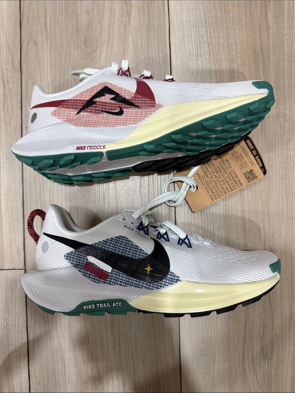 Nike White Trail Running Shoes with Green Outsoles and Black Swoosh